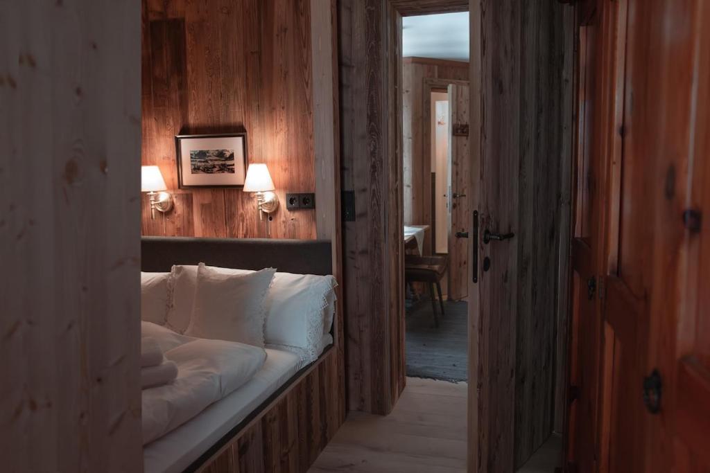 a hallway with a bed in a room at Löw Chalet Suite 1 in the Heart of Kitzbühel by 360 Estates in Kitzbühel