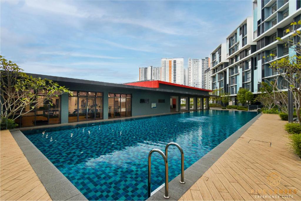 a swimming pool in the middle of a building at KIP Core Soho Suite by Five Senses in Sepang