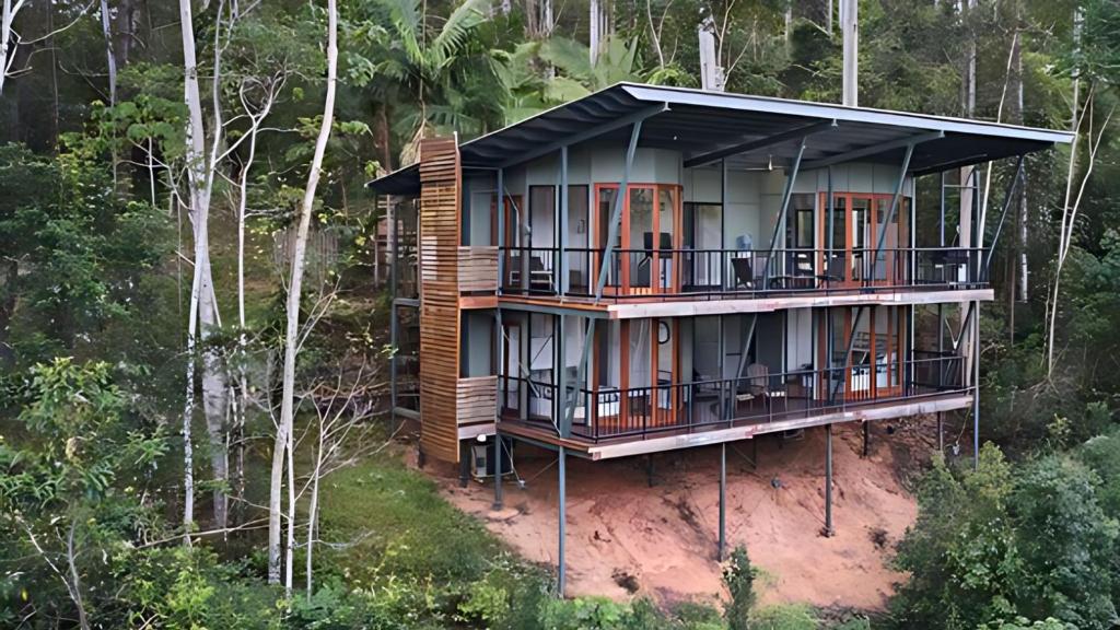 a house in the middle of the forest at Ecoasis Mami Wata Rainforest Haven in Uki