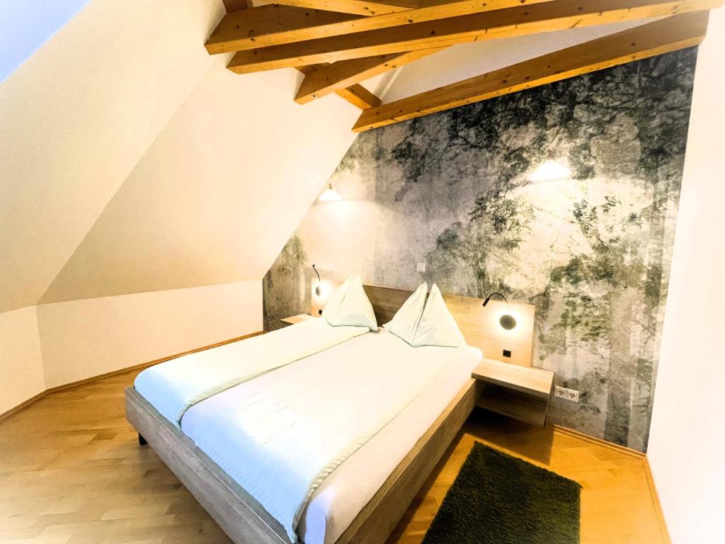 a bed in a room with a wall mural at Ferienhof Uhudler-Arkaden in Stegersbach