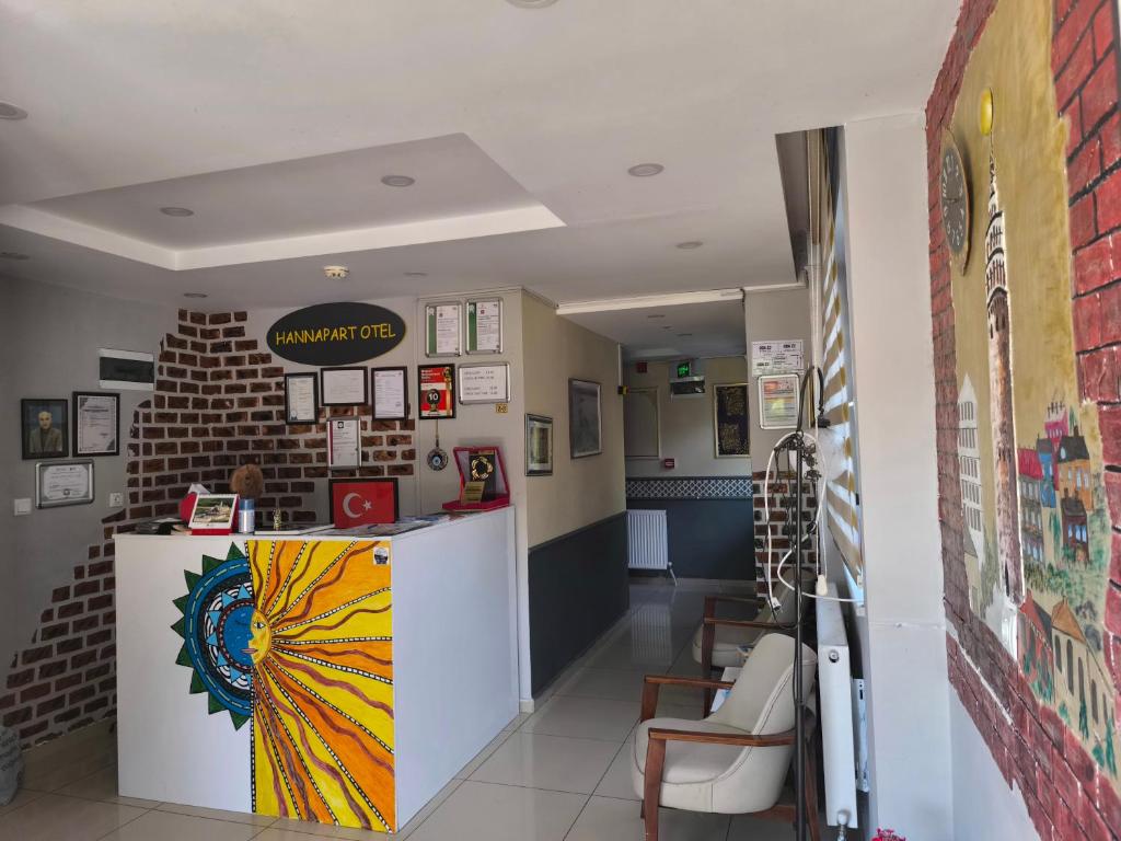 a restaurant with a counter and chairs in a room at Hannapart Otel in Egirdir