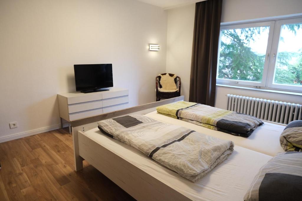 Postel nebo postele na pokoji v ubytování Panoramablick vom Rodenberg