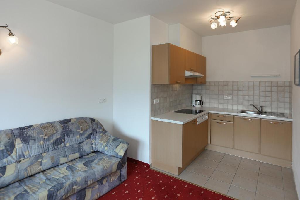 Kuchyň nebo kuchyňský kout v ubytování Hotel & Residence Egger