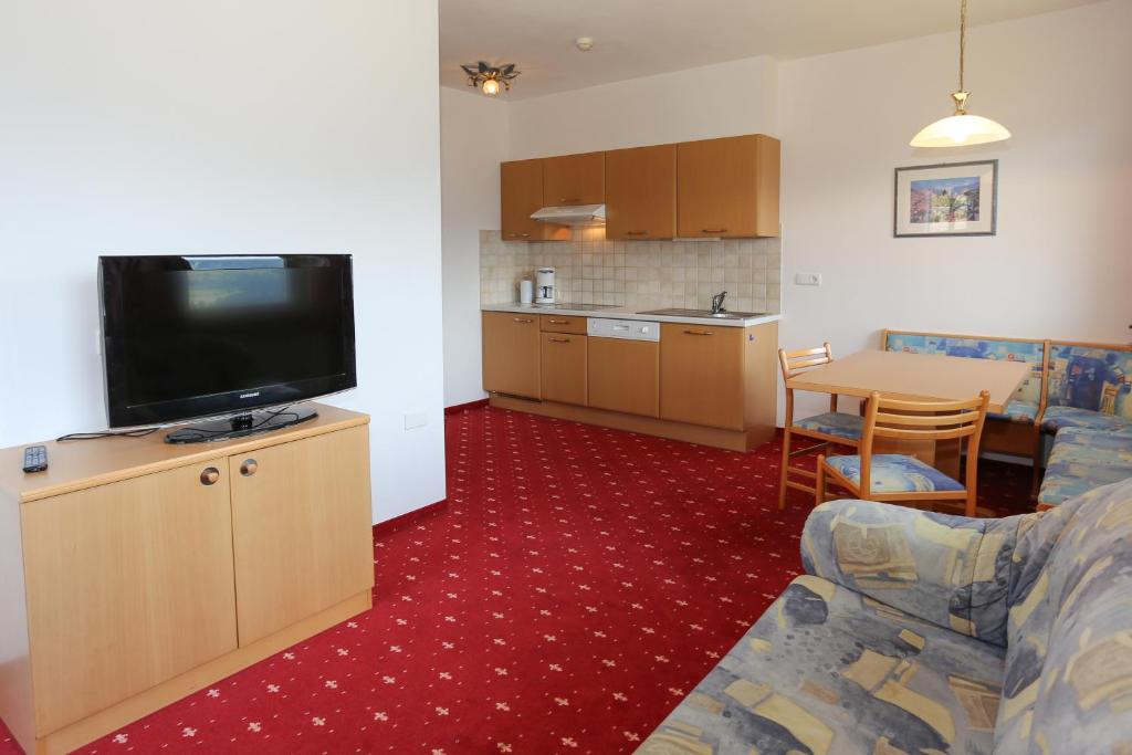 Kuchyň nebo kuchyňský kout v ubytování Hotel & Residence Egger