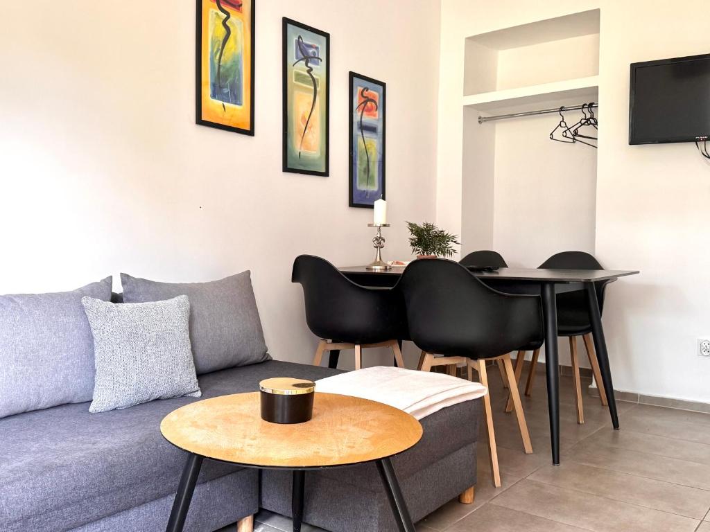 a living room with a couch and a table at Familly Apartament 6 in Międzyzdroje