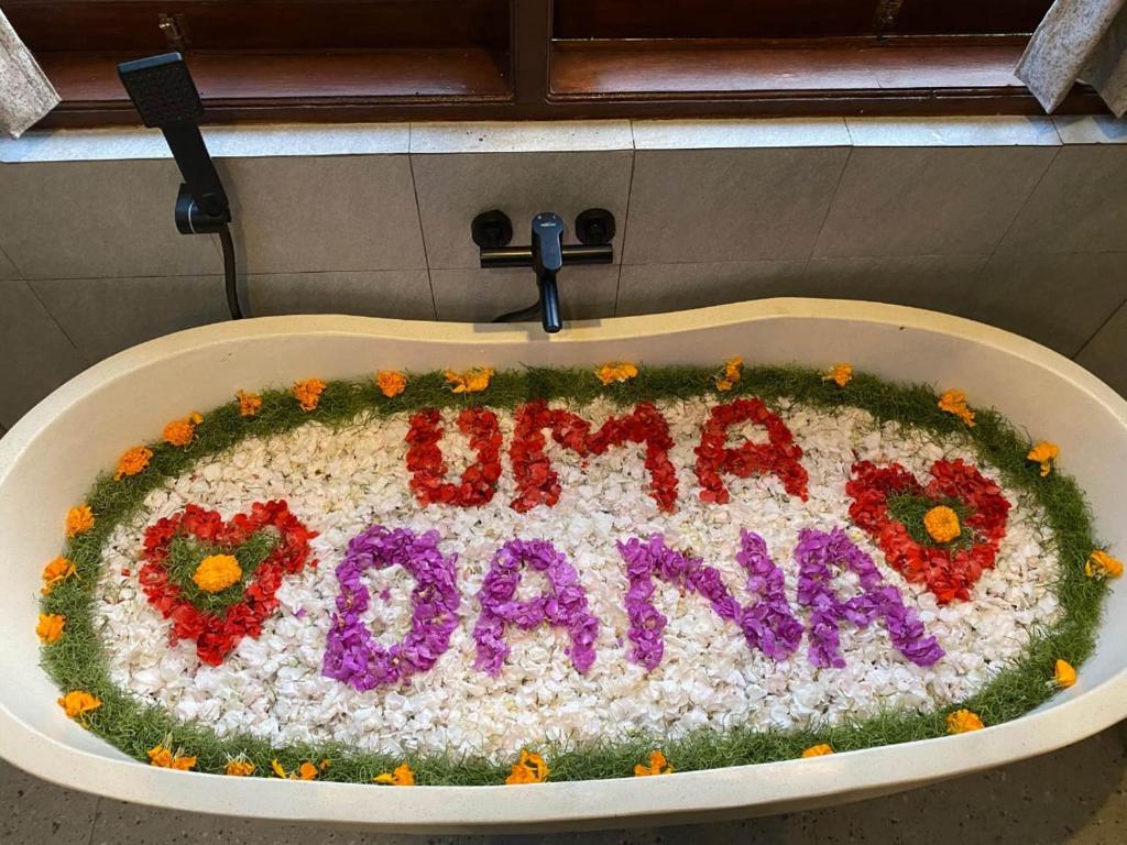 a birthday cake in a sink with the words mumamaama at Umadana Serenity Nature Ubud by EPS in Ubud