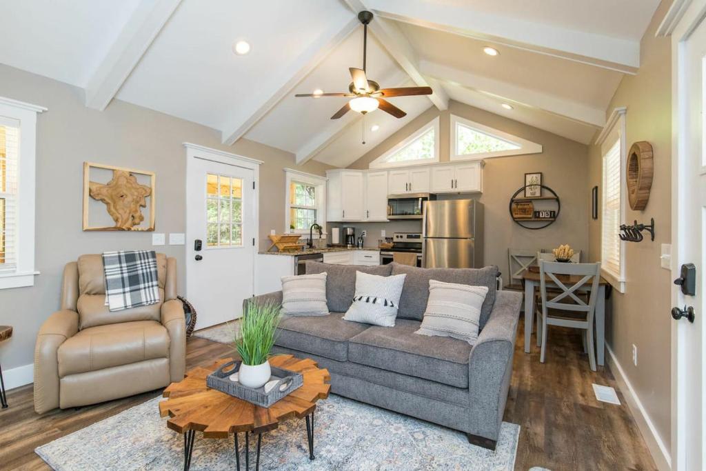 a living room with a couch and a table at WiFi & Waterfront - Soul Sister Red River Gorge KY in Rogers