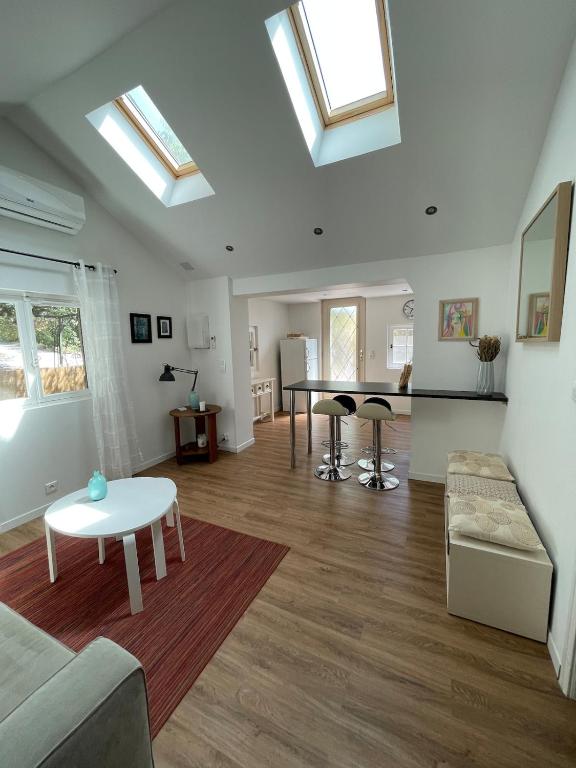 a living room with a couch and a table at Charmant Mazet en campagne provencale in Châteaurenard