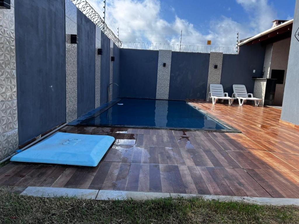 Swimmingpoolen hos eller tæt på Casa de Férias com Piscina