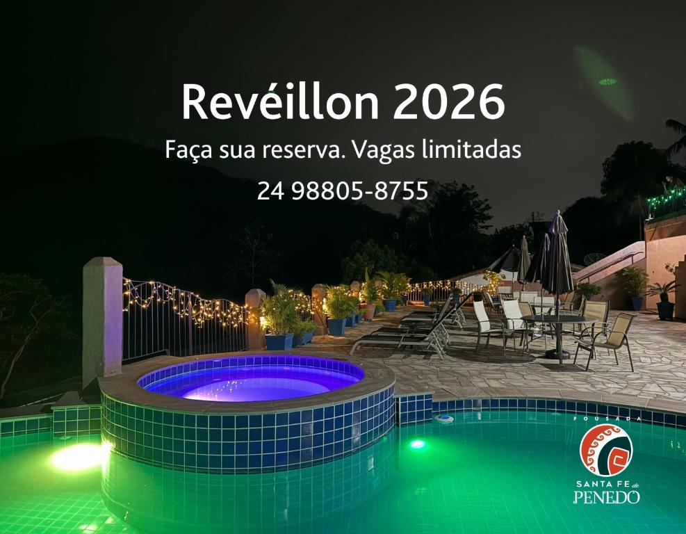 a sign for a resort with a swimming pool at Pousada Santa Fe de Penedo in Penedo