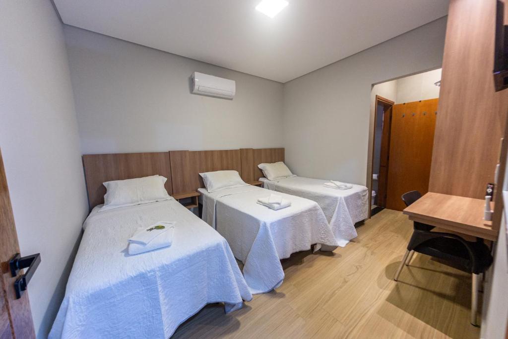 Ένα ή περισσότερα κρεβάτια σε δωμάτιο στο Pousada Flat Moreira Lima