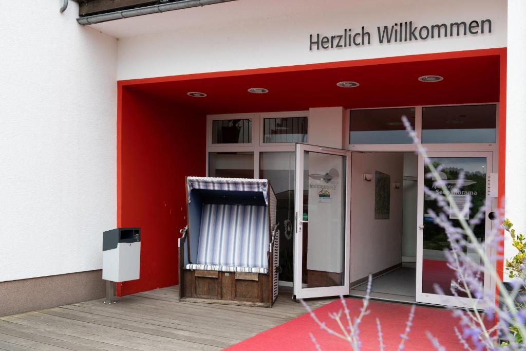 an entrance to a hospital with a red building at Eisvogel Classic 217 in Granzow