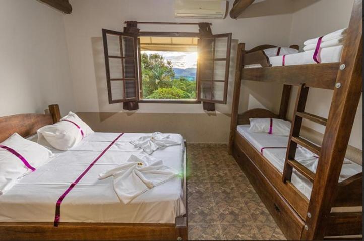 Postel nebo postele na pokoji v ubytování Hotel Fazenda Portal dos Sonhos