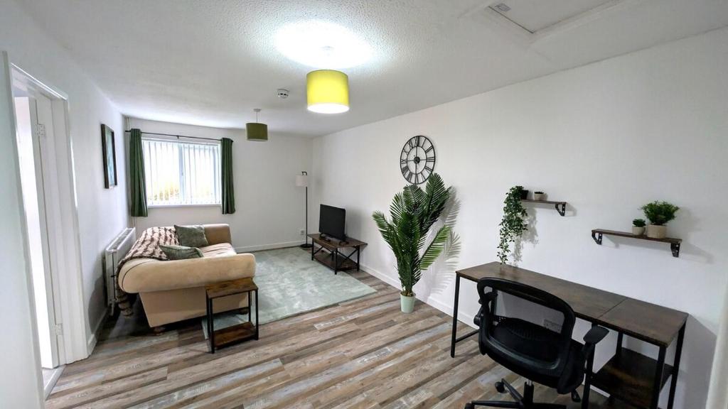 Χώρος καθιστικού στο Tŷ Cefn at The Lodge