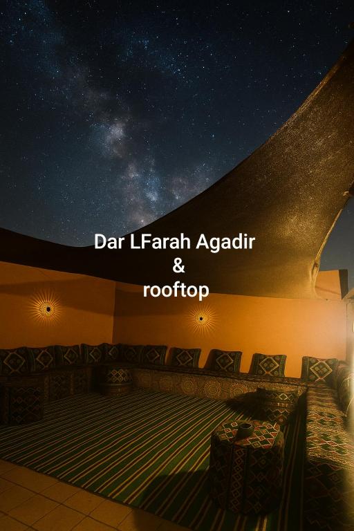 a room with a starry sky and a stage at Dar LFarah Agadir & Rooftop in Agadir