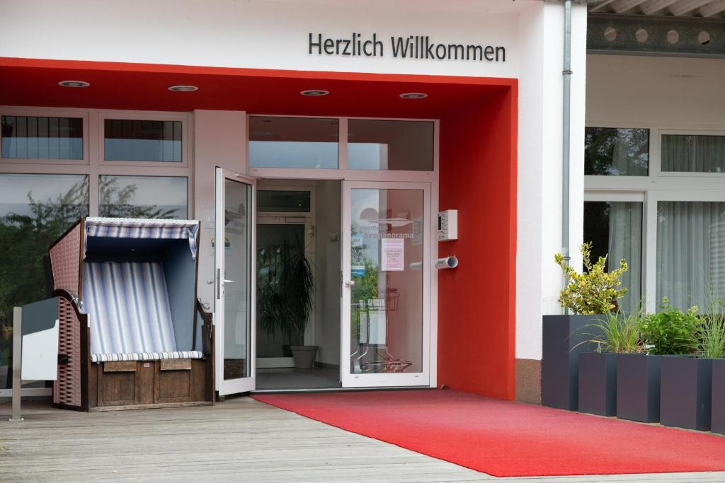 an entrance to a hospital with a red door at Schneeeule 225 in Granzow