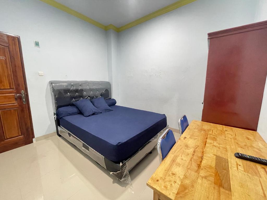 Ένα ή περισσότερα κρεβάτια σε δωμάτιο στο Blissful Executive Kost