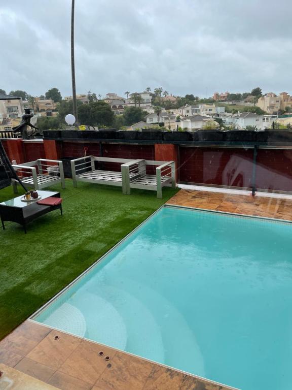 a swimming pool on the roof of a building at Villa balcones in Los Altos