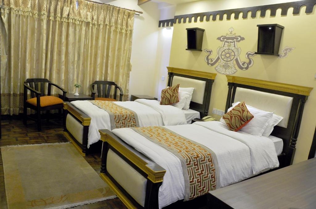 Postel nebo postele na pokoji v ubytování Hotel Encounter Nepal & Spa