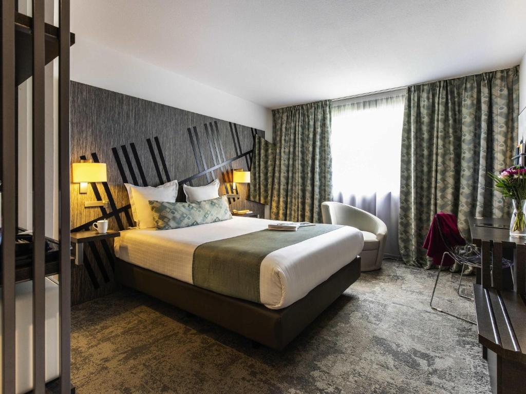 Postel nebo postele na pokoji v ubytování Mercure Belfort Centre