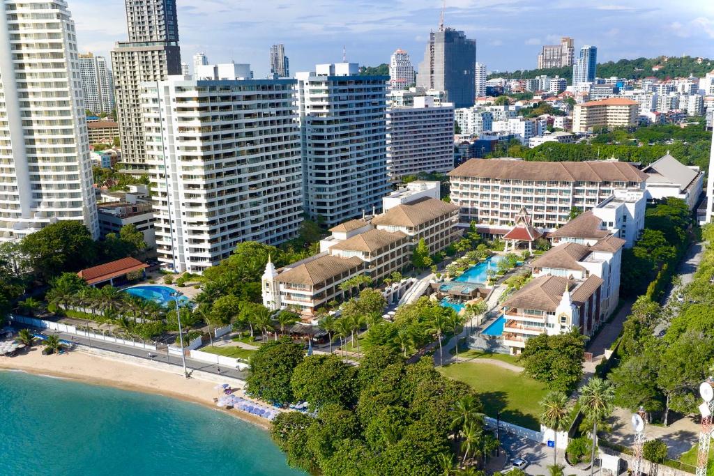 an aerial view of a resort with a beach and buildings at The Heritage Pattaya Beachfront Resort in Pattaya South