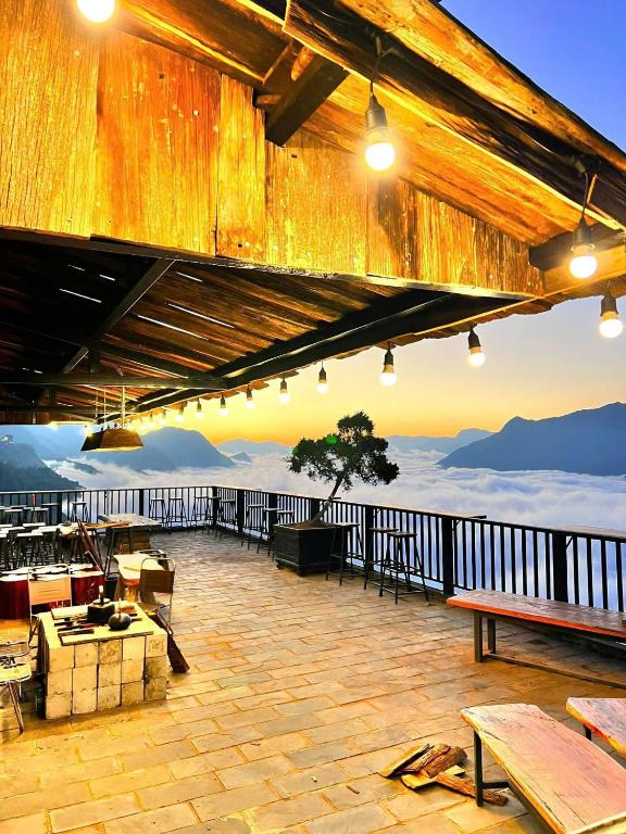 a patio with a view of the mountains at Hầu Thào Villa & Coffee in Sapa