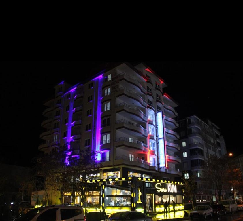 a building with purple lights on it at night at butik konaklama in Aksaray