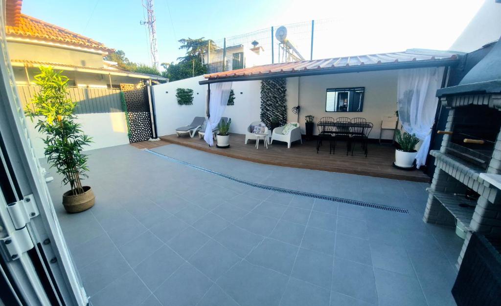 a view of a house with a patio at Arrábida Cozy House in Palmela