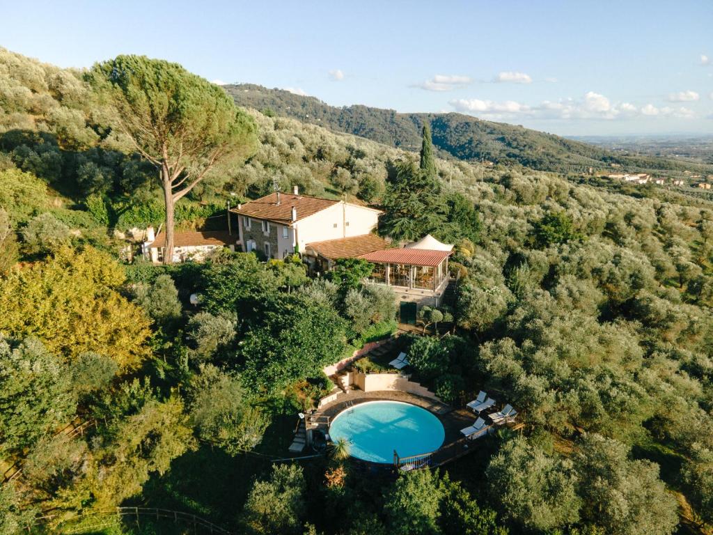 an aerial view of a house in the forest at Aura Toscana Boutique in Monsummano