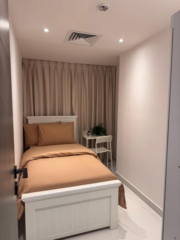 Postel nebo postele na pokoji v ubytování Vogue Inn Abu Dhabi