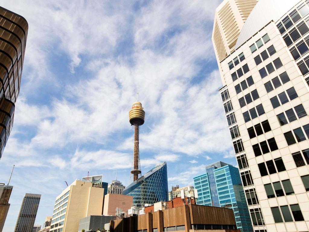 a view of the space needle in a city at The Sebel Sydney Martin Place in Sydney