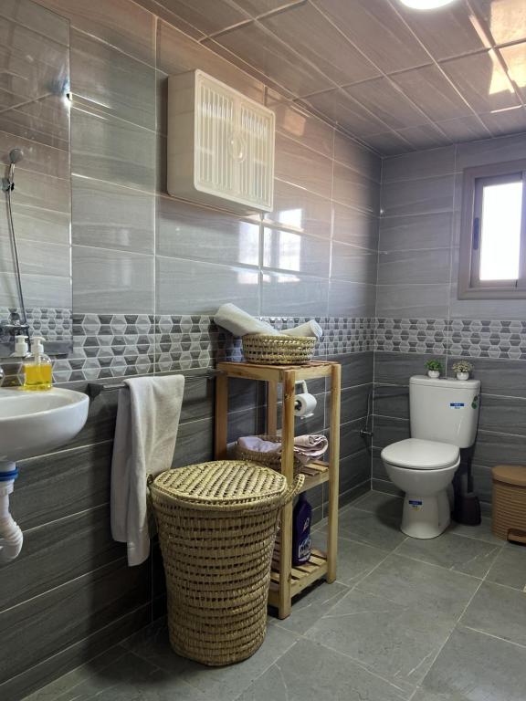 a bathroom with a toilet and a sink at Nova guest house in Ouarzazate