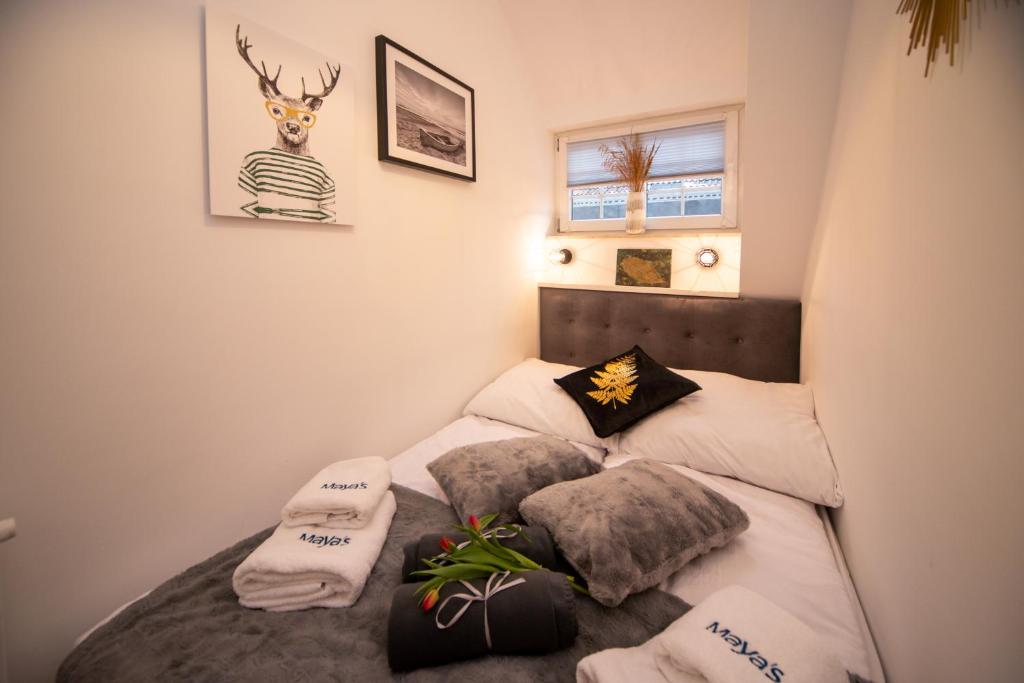 a bedroom with two twin beds with pillows at Maya's Flats - Dluga 66 Attic Gdansk in Gdańsk