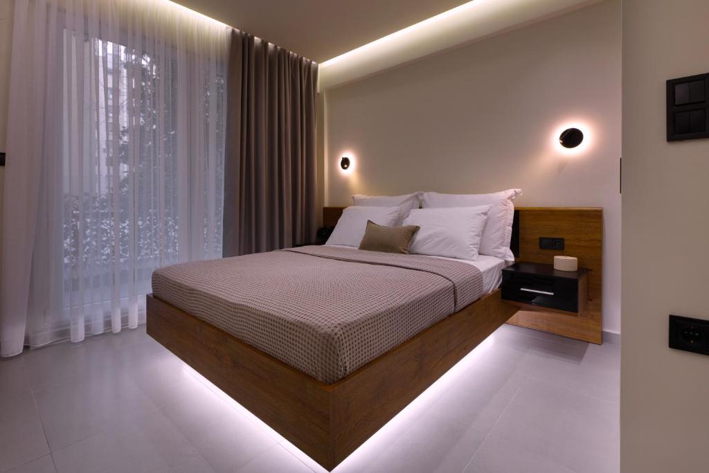 a bedroom with a bed and a window at Aristotelous rooms Nikol in Thessaloniki