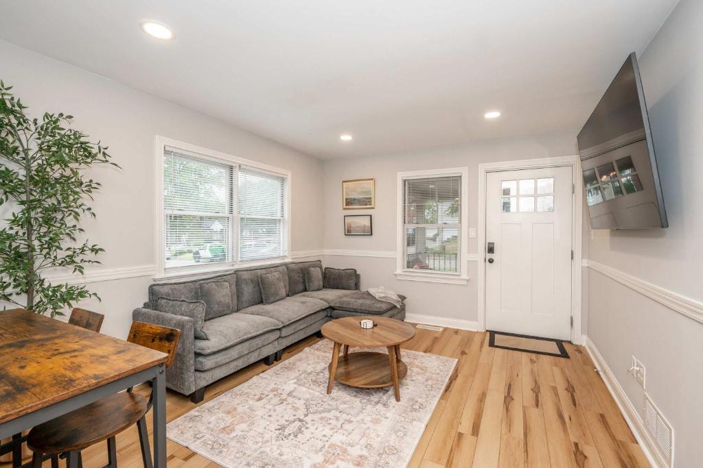 a living room with a couch and a table at Valley Ridge Retreat - For 8 in Cincinnati