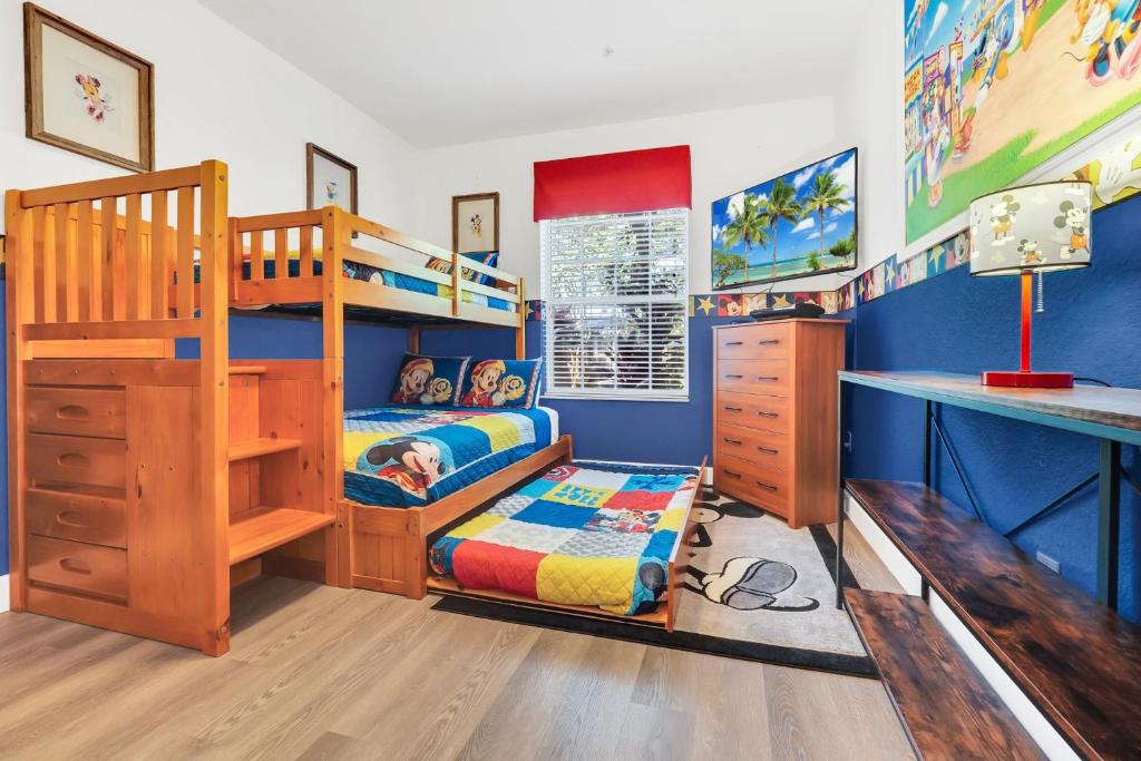 a bedroom with a bunk bed and a desk at Disney Bunk Room--Windsor Hills in Orlando