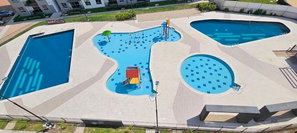 Bazén v ubytování Condominio AZUL RICAURTE Apartamento con 4 piscinas nebo v jeho okolí