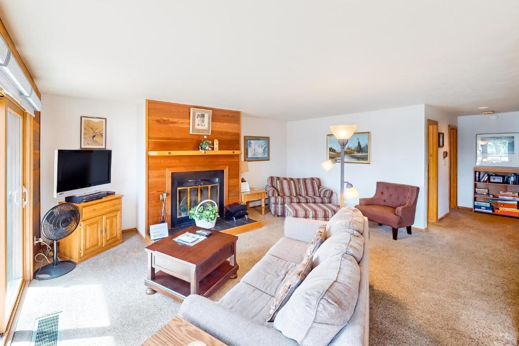 a living room with a couch and a fireplace at Timber Ridge 203 in Silverthorne