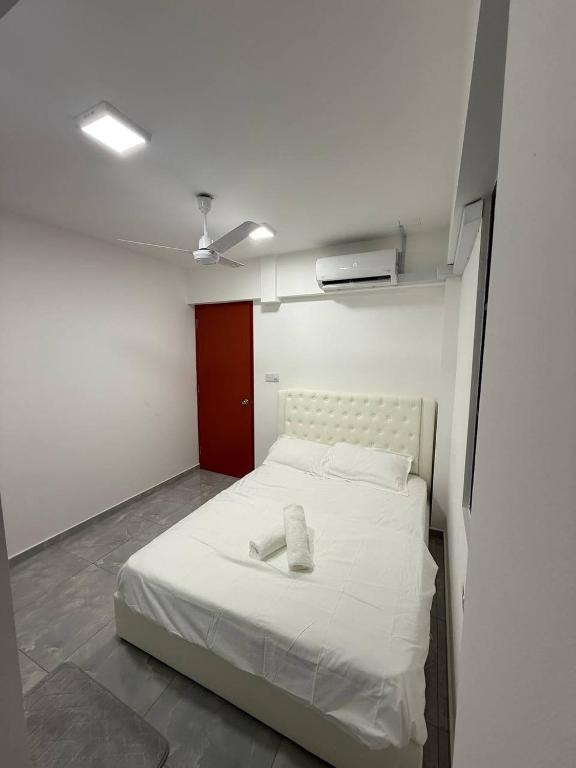 a white bed in a room with a ceiling at apartment in hulhumale' in Hulhumale