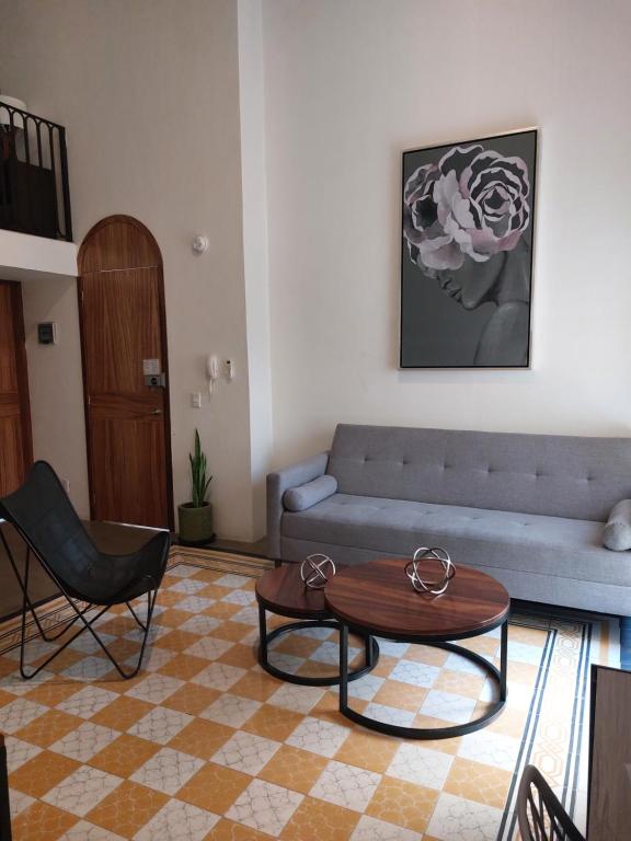a living room with a couch and a table at Casa Monarcas - Josefina (with AC) in Guadalajara