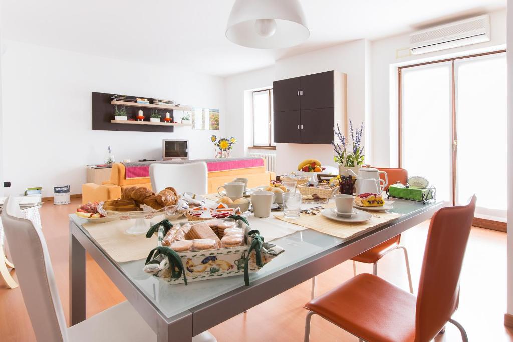 a kitchen with a table with food on it at B&B La Corte in Mese