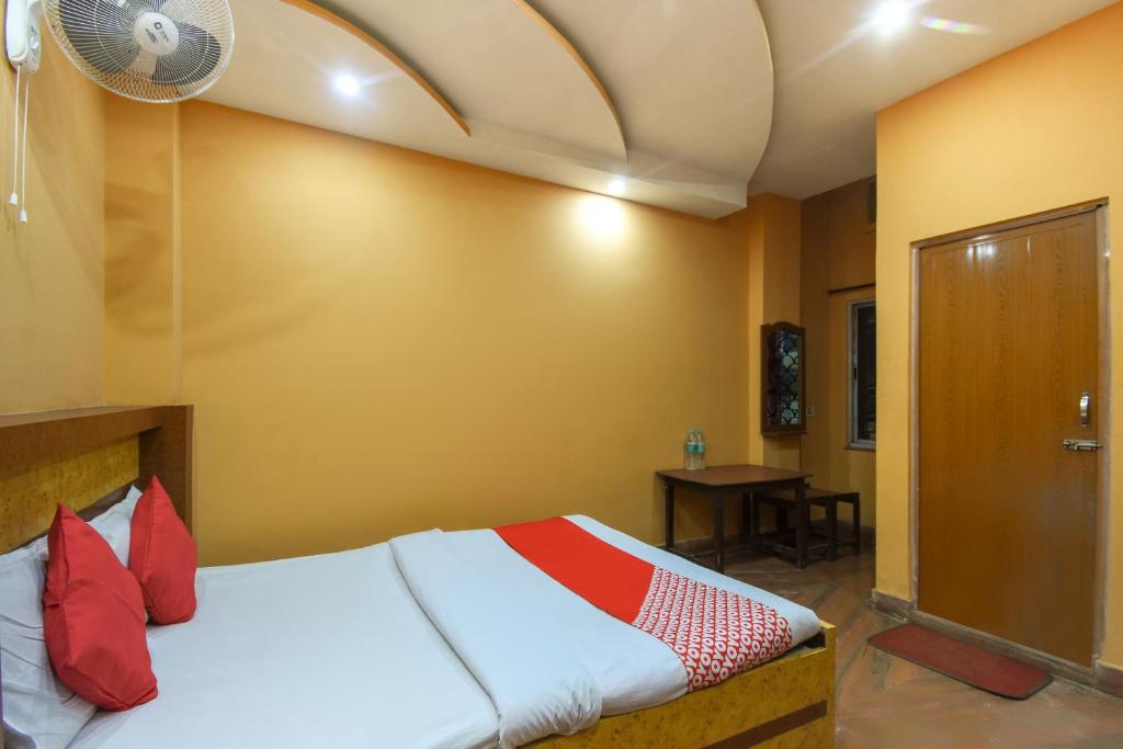 Postel nebo postele na pokoji v ubytování Hotel O Gour