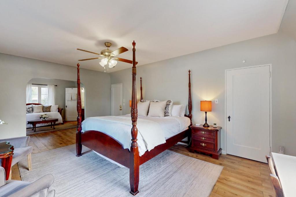 a bedroom with a bed and a ceiling fan at Santa Rosa in Santa Barbara