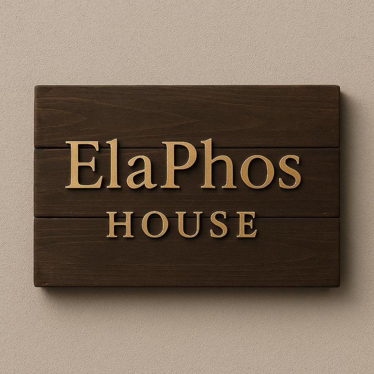 a sign that reads elphos house on a wall at ElaPhos HOUSE in Kiriákion