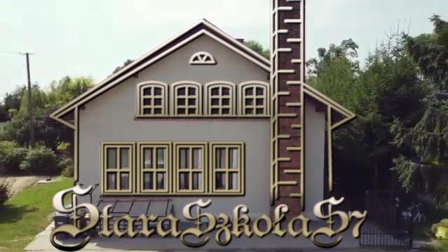 a house with a ladder on the side of it at Stara Szkoła S7 Noclegi Mazury, Zajezierze 8 14-330 Małdyty in Małdyty