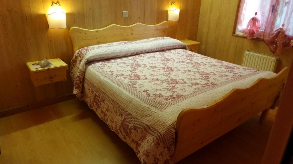 Postel nebo postele na pokoji v ubytování Albergo Ristorante K2