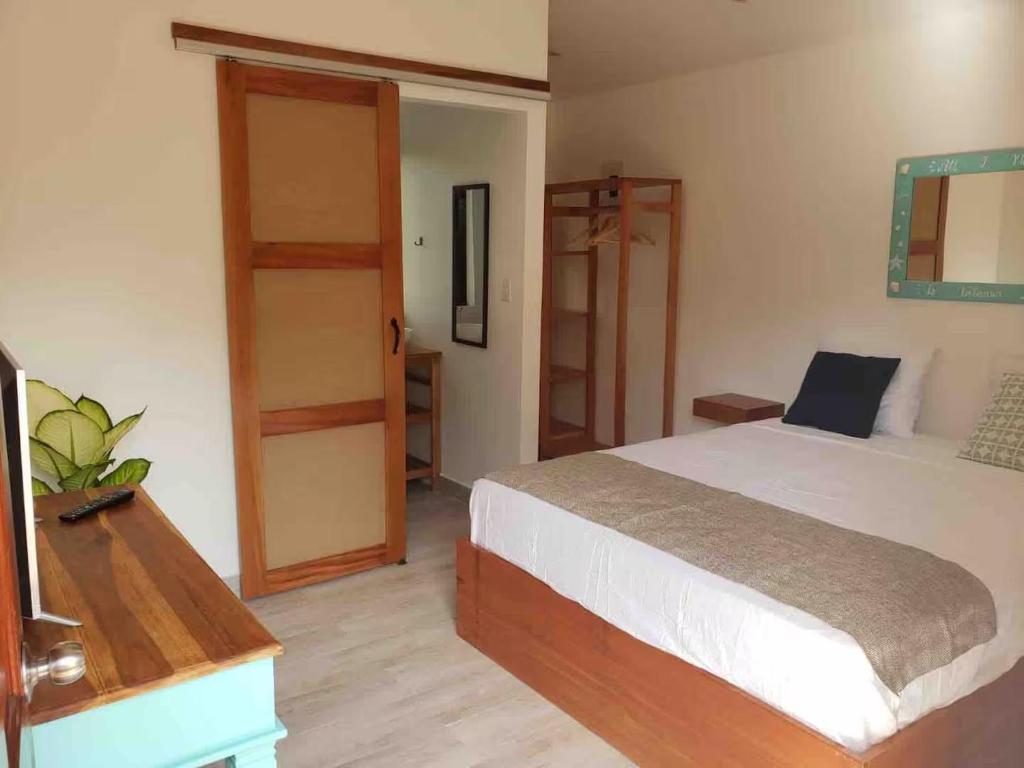 En eller flere senge i et værelse på La Buena vida Cabina 2