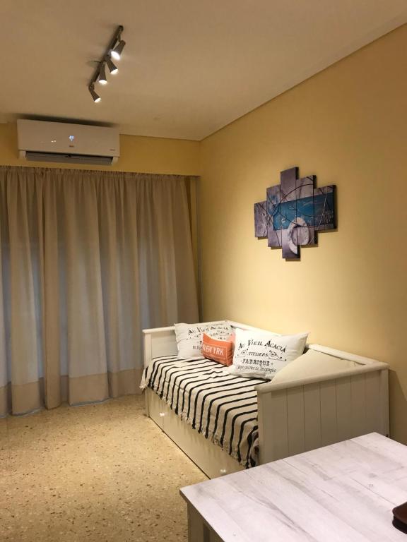 a small bedroom with a bed and a window at Vista al mar in Mar del Plata