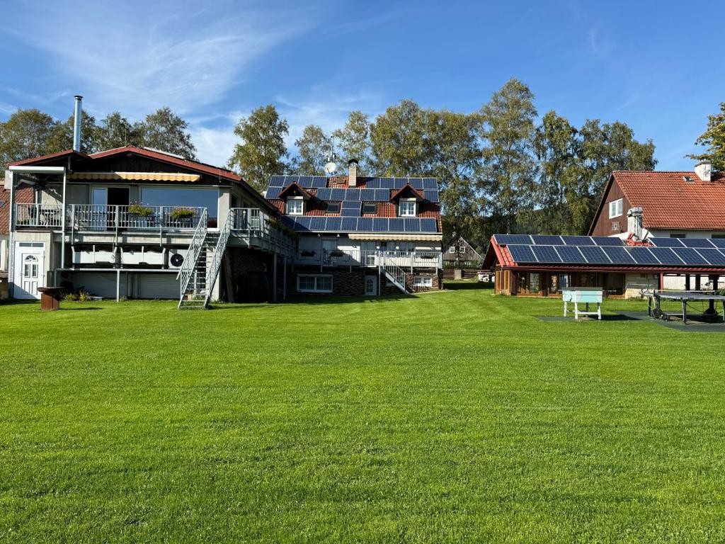 a house with solar panels on the side of it at Pension Kohler in Deštné v Orlických horách