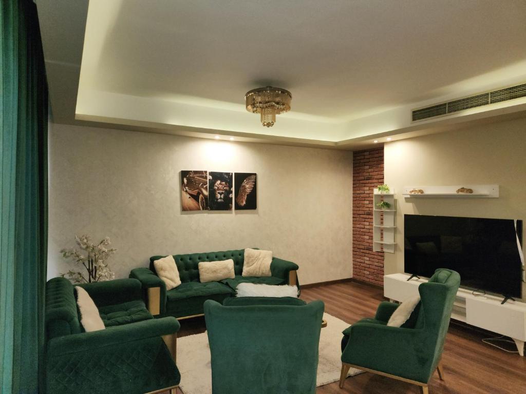 Χώρος καθιστικού στο Cozy green stay